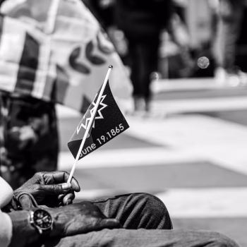 Man Holding Juneteenth Flag